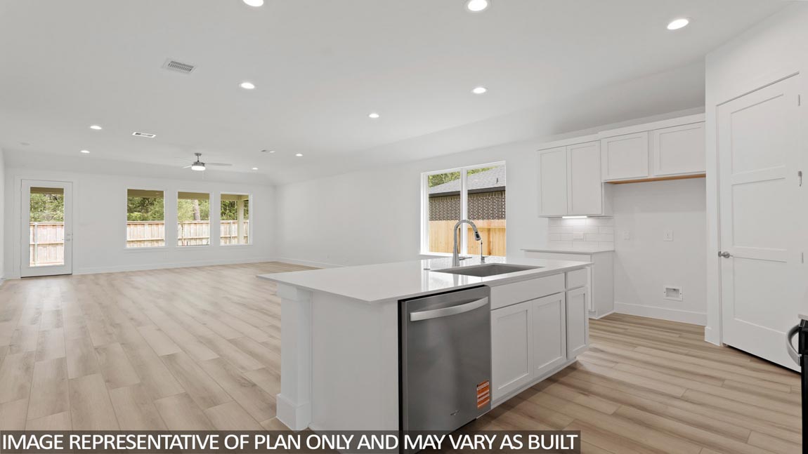 Kitchen with an island and vinyl floor