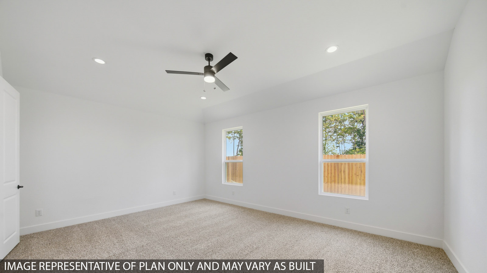 Large Primary bedroom with shag carpet flooring and bright window
