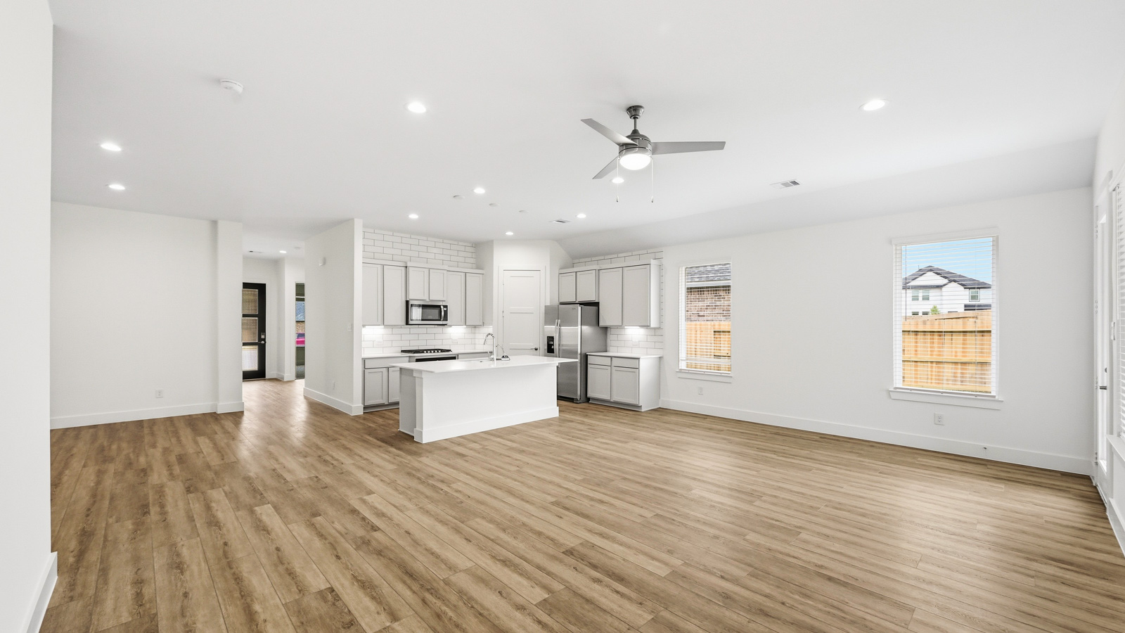 Kitchen with an island and vinyl floor