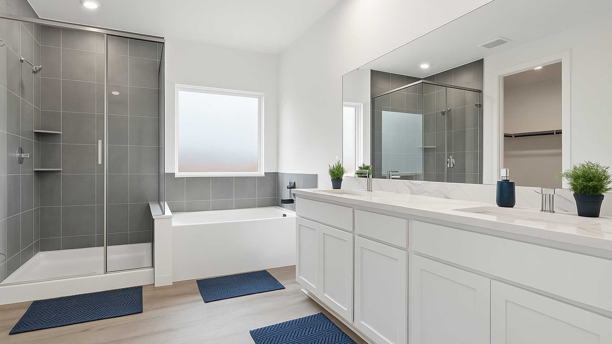 Primary bathroom with tub and shower