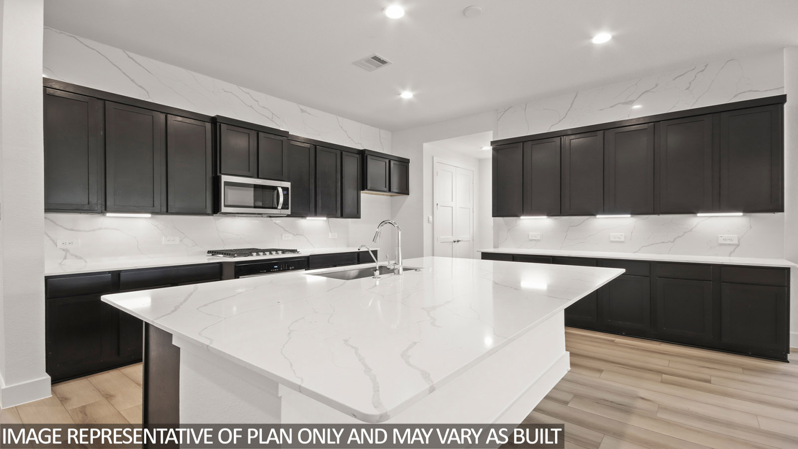 Kitchen with stainless-steel appliances and island.