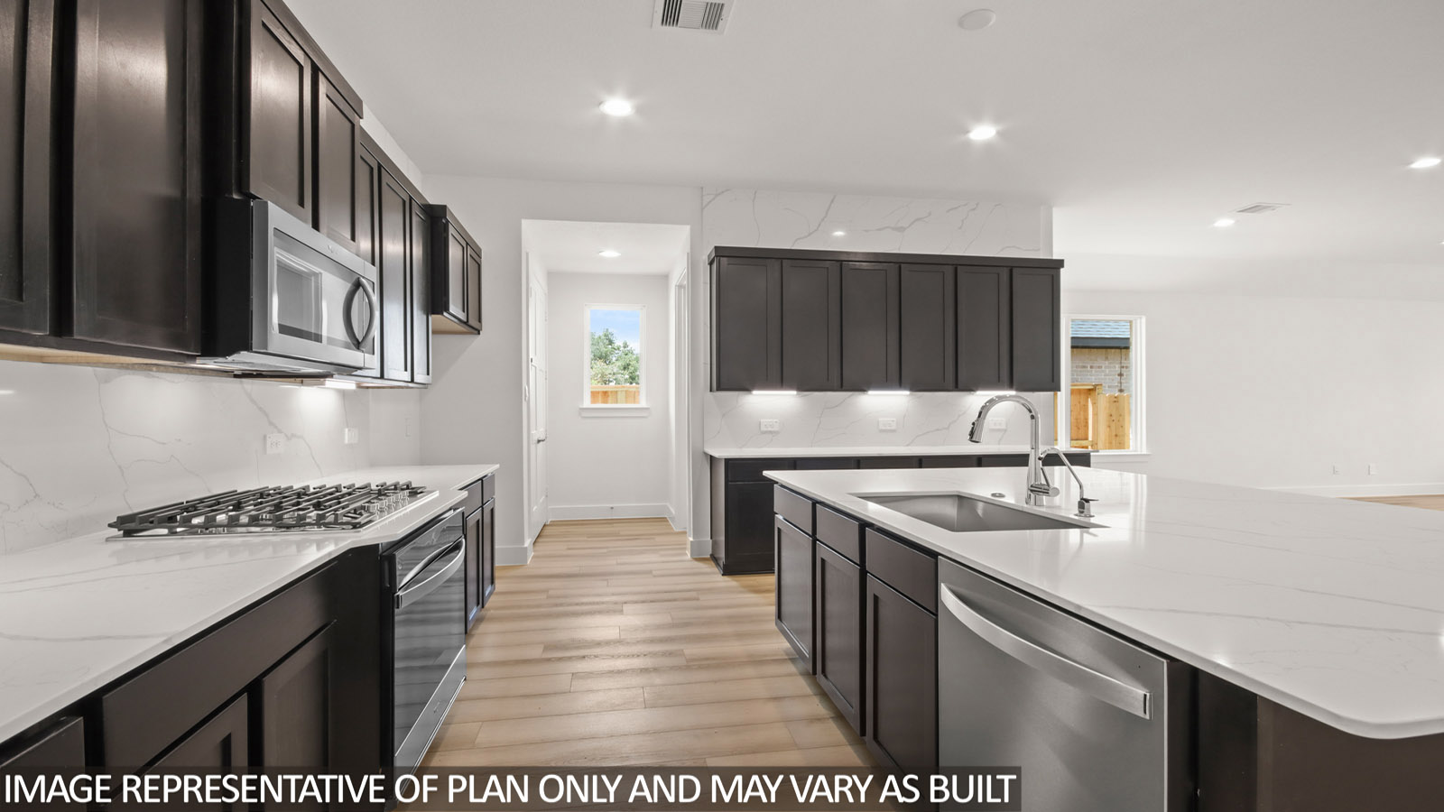Kitchen with stainless-steel appliances and island.