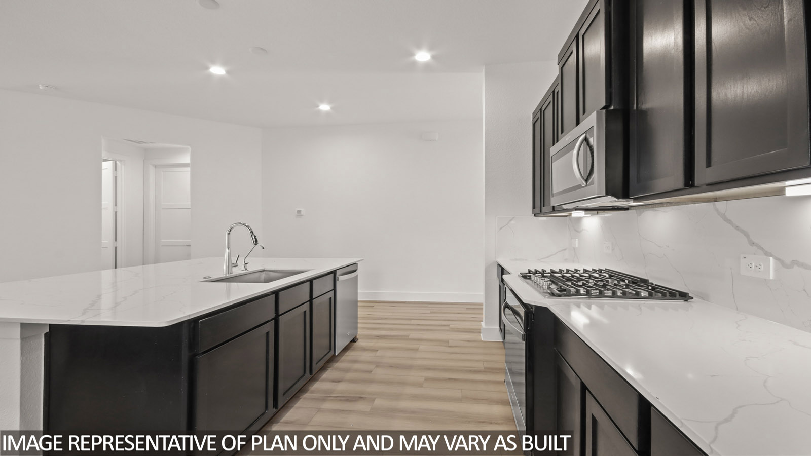 Kitchen with stainless-steel appliances and island.