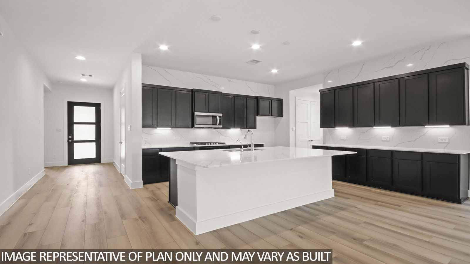 Kitchen with stainless-steel appliances and island.