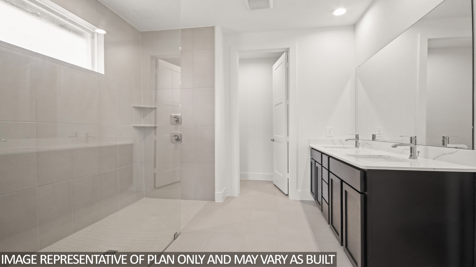 Primary bathroom with vinyl flooring and double sink.