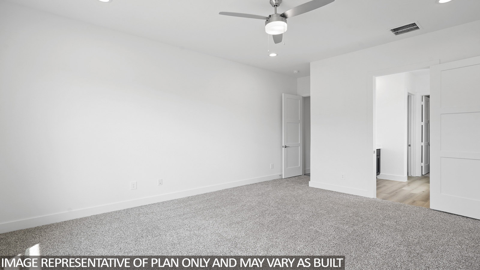 Primary bedroom with carpet flooring