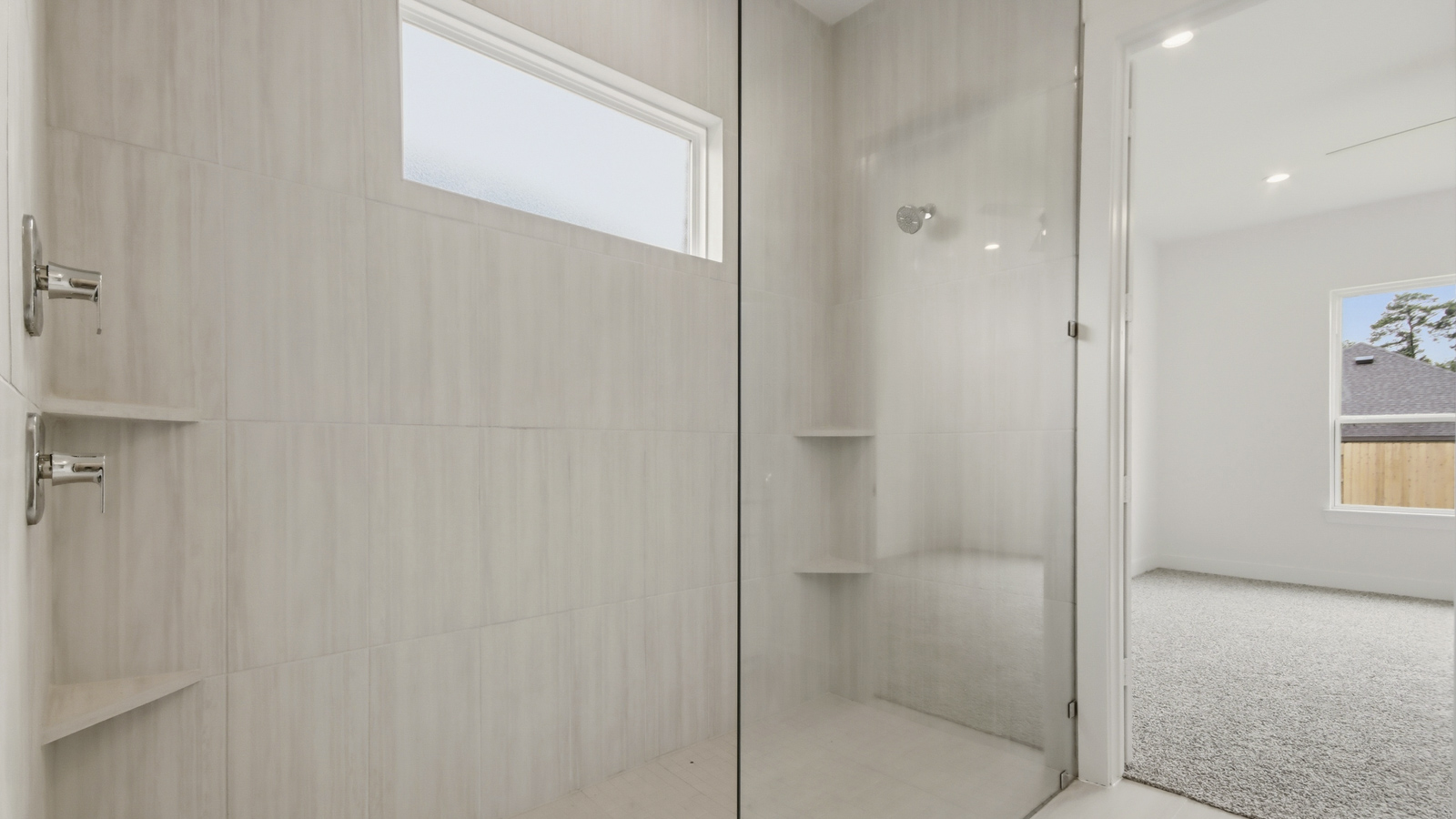 Primary bathroom with super shower with semi frameless glass in Conroe  TX