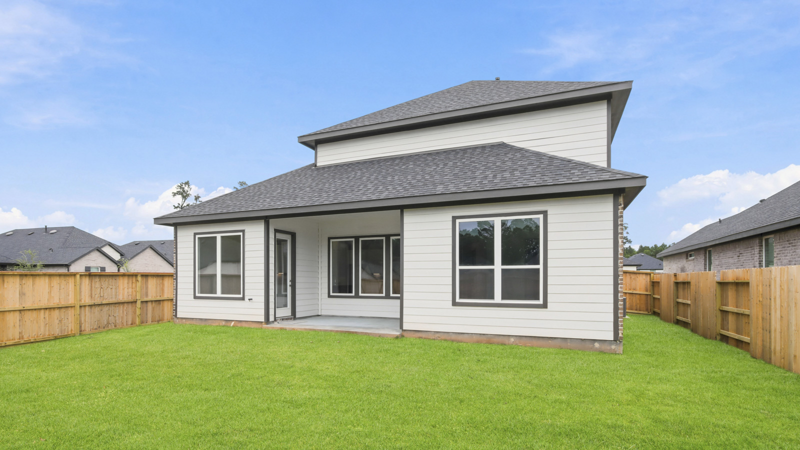 covered patio with jamies hardie siding and overhead lighting