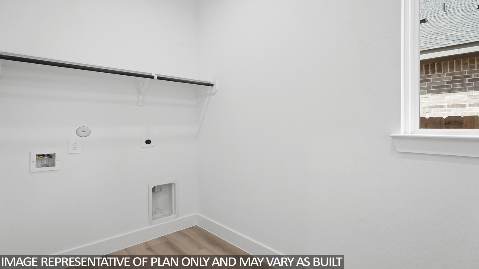 Utility laundry smartly designed with washer and dryer included, overhead shelving, and functional storage