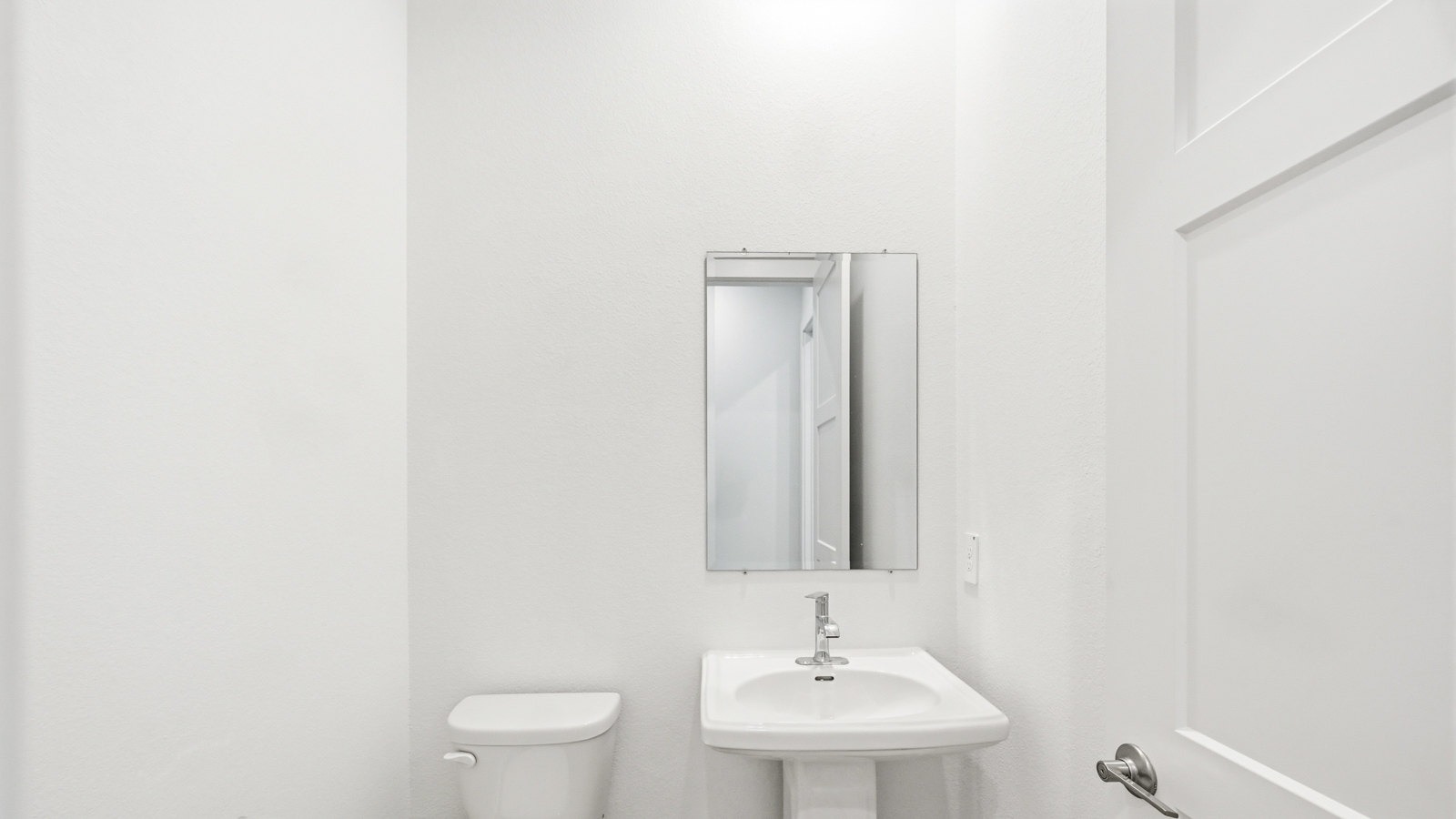 Powder bathroom with pedestal sink
