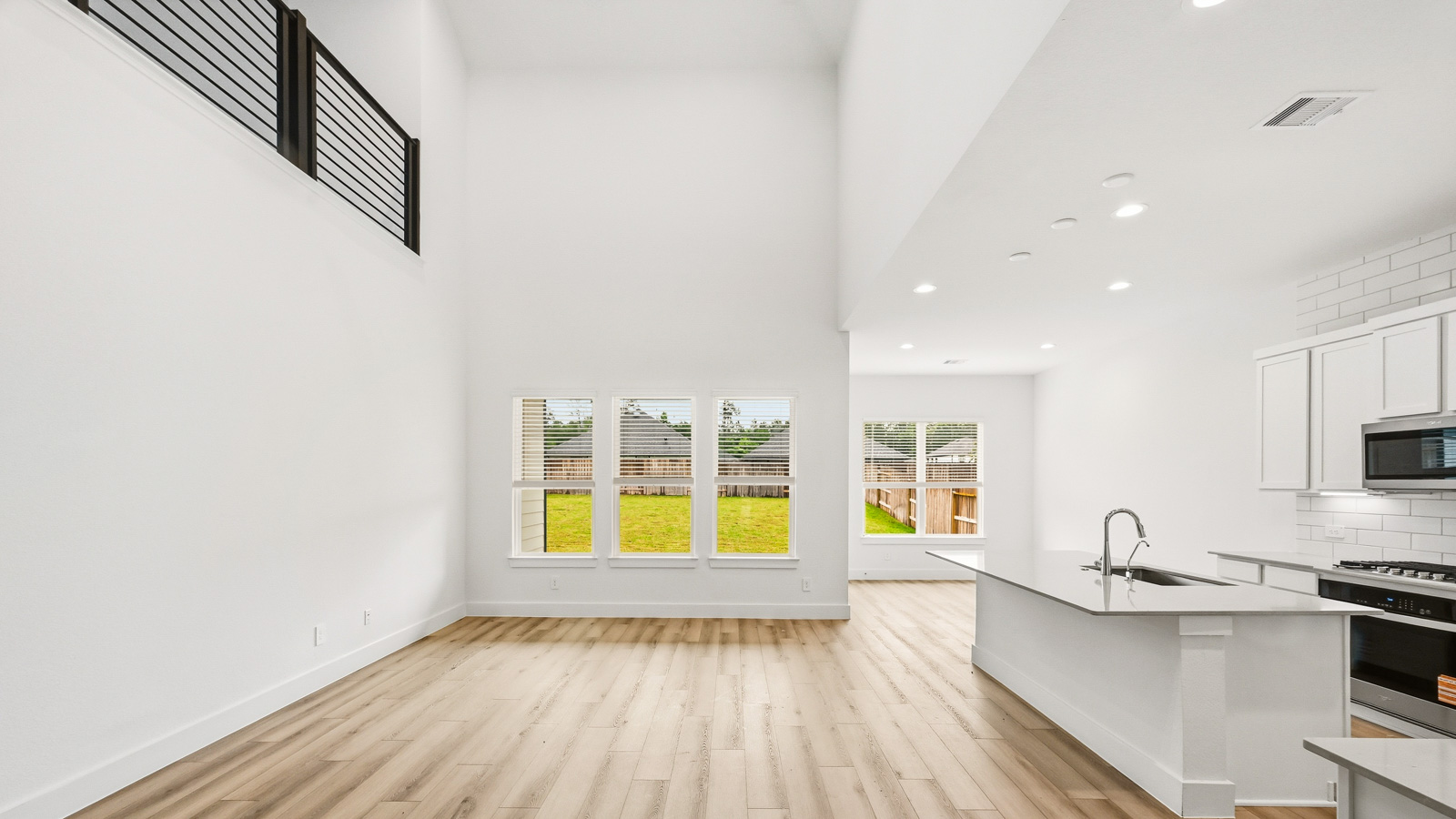 Kitchen with an island and vinyl floor