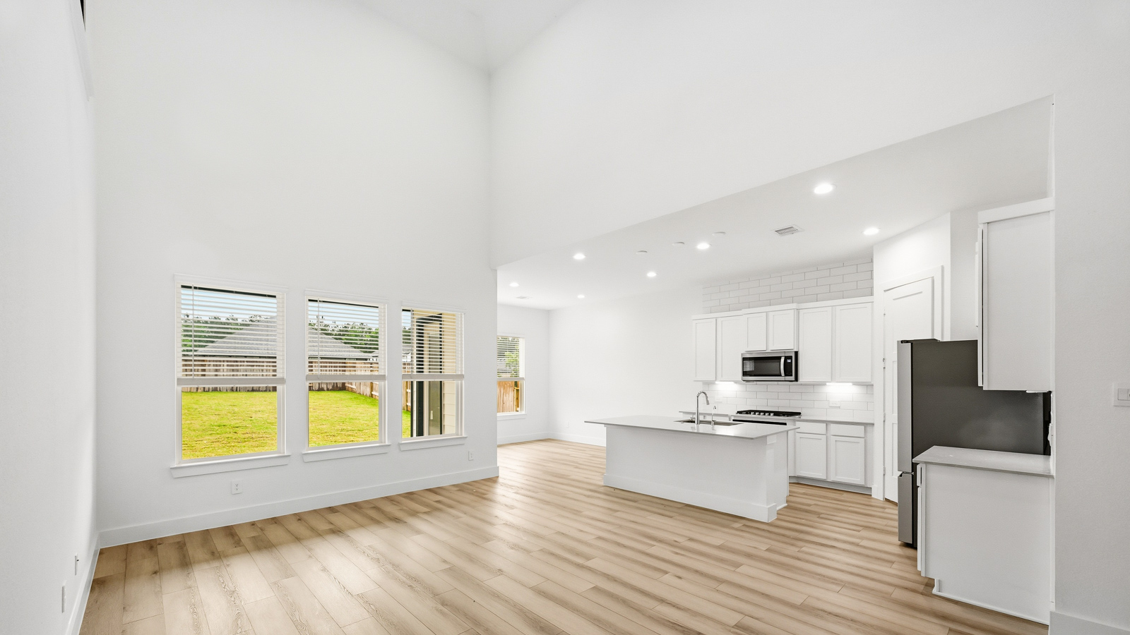 Kitchen with an island and vinyl floor