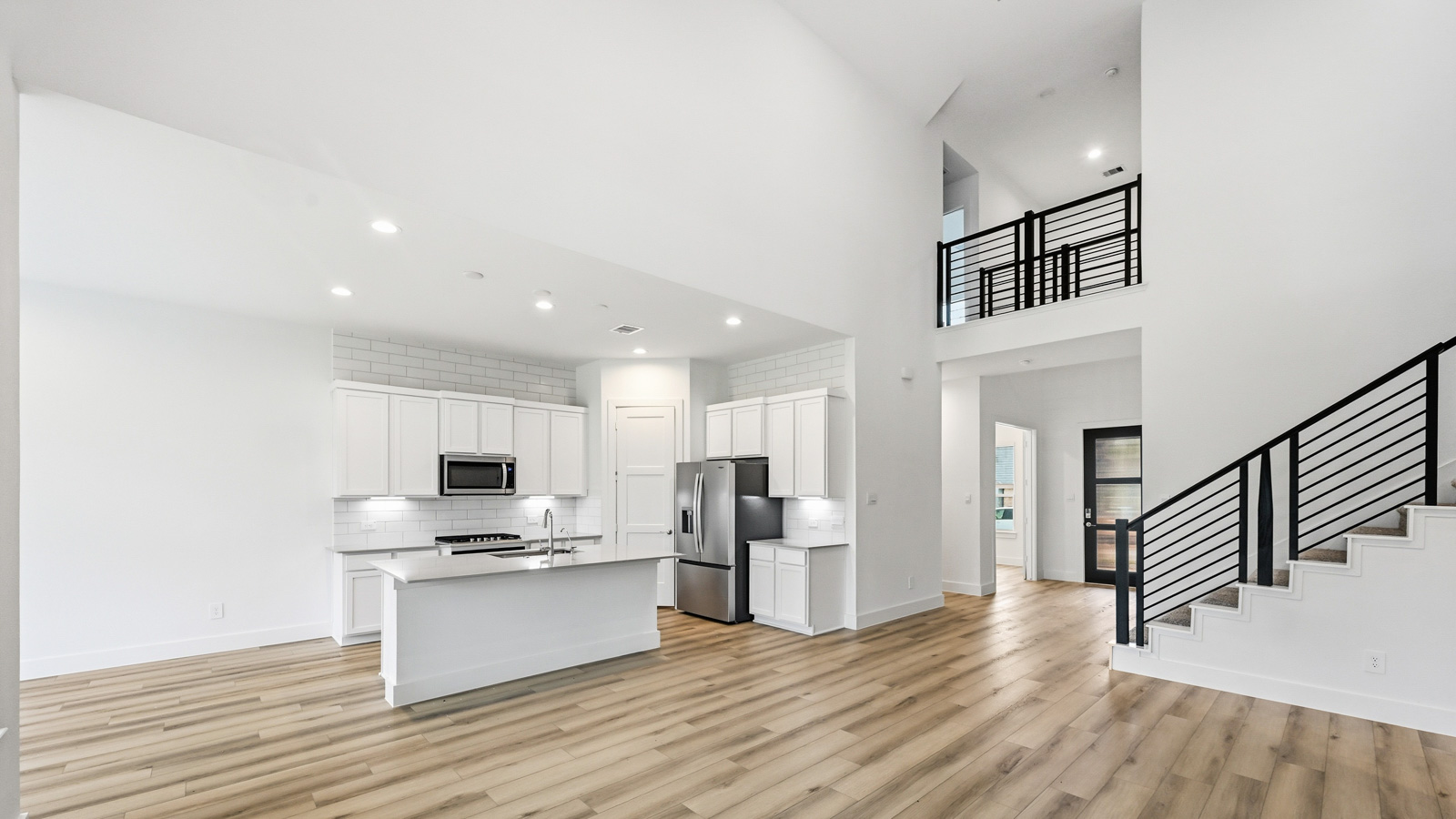 Kitchen with an island and vinyl floor