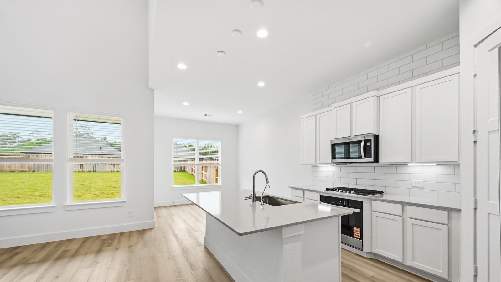 Kitchen with an island and vinyl floor