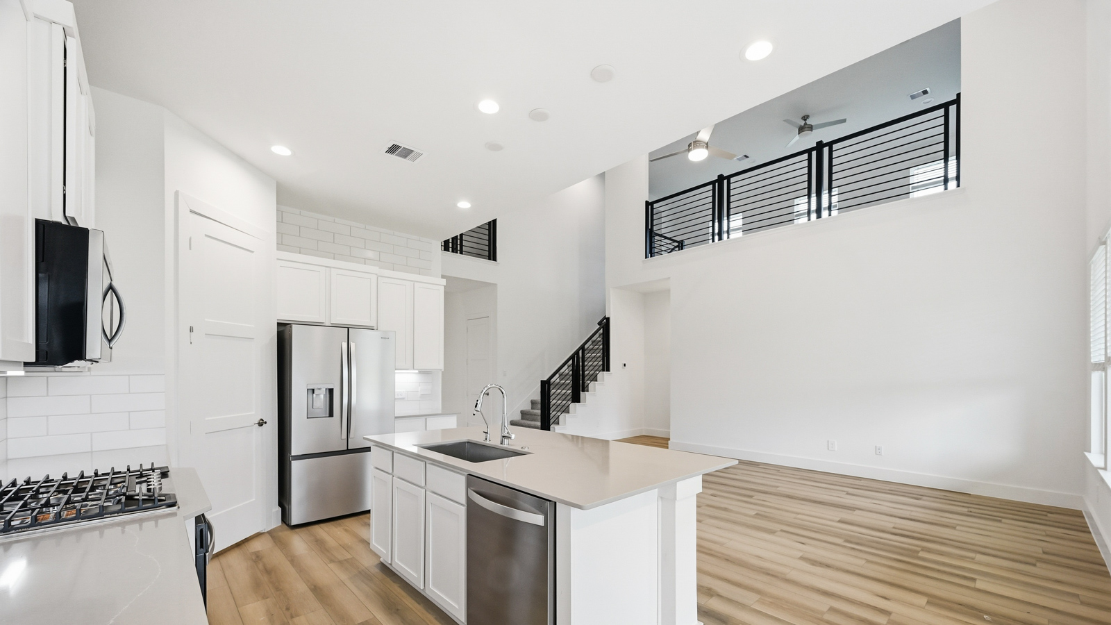 Kitchen with an island and vinyl floor