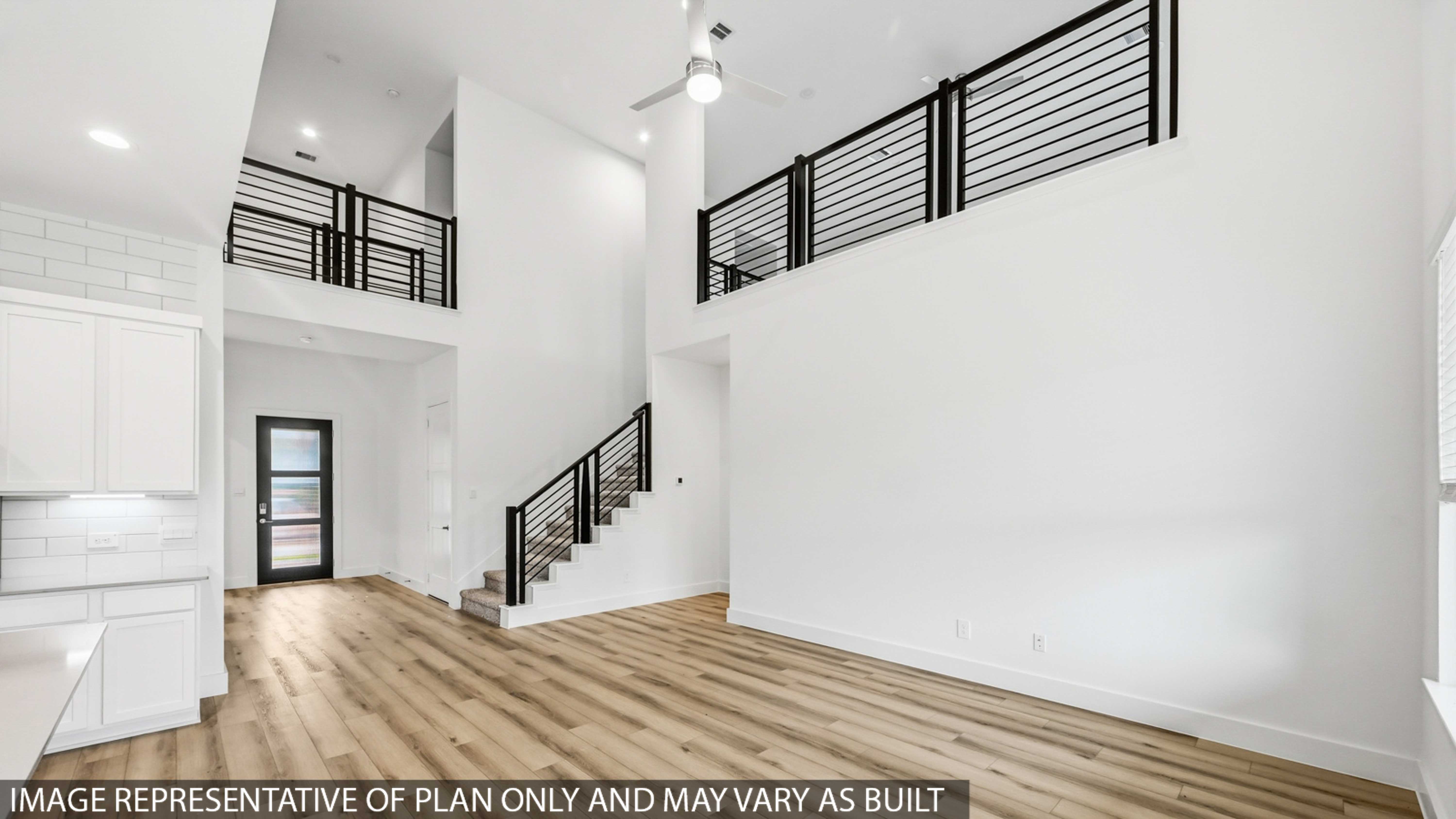 Spacious living area with vinyl flooring and bright windows in Montgomery TX