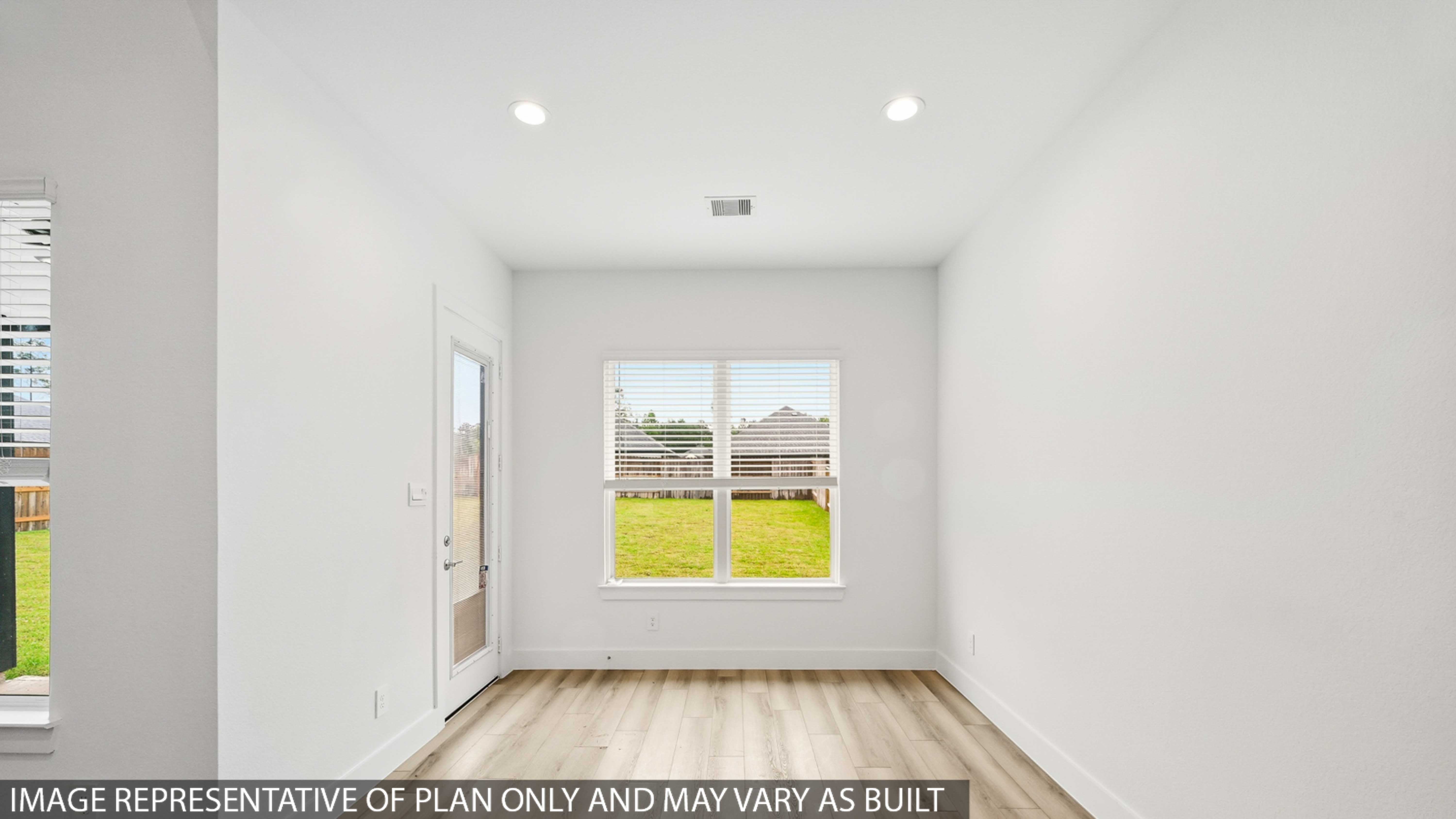 Dining area with vinyl flooring located off from the living room area in Montgomery TX