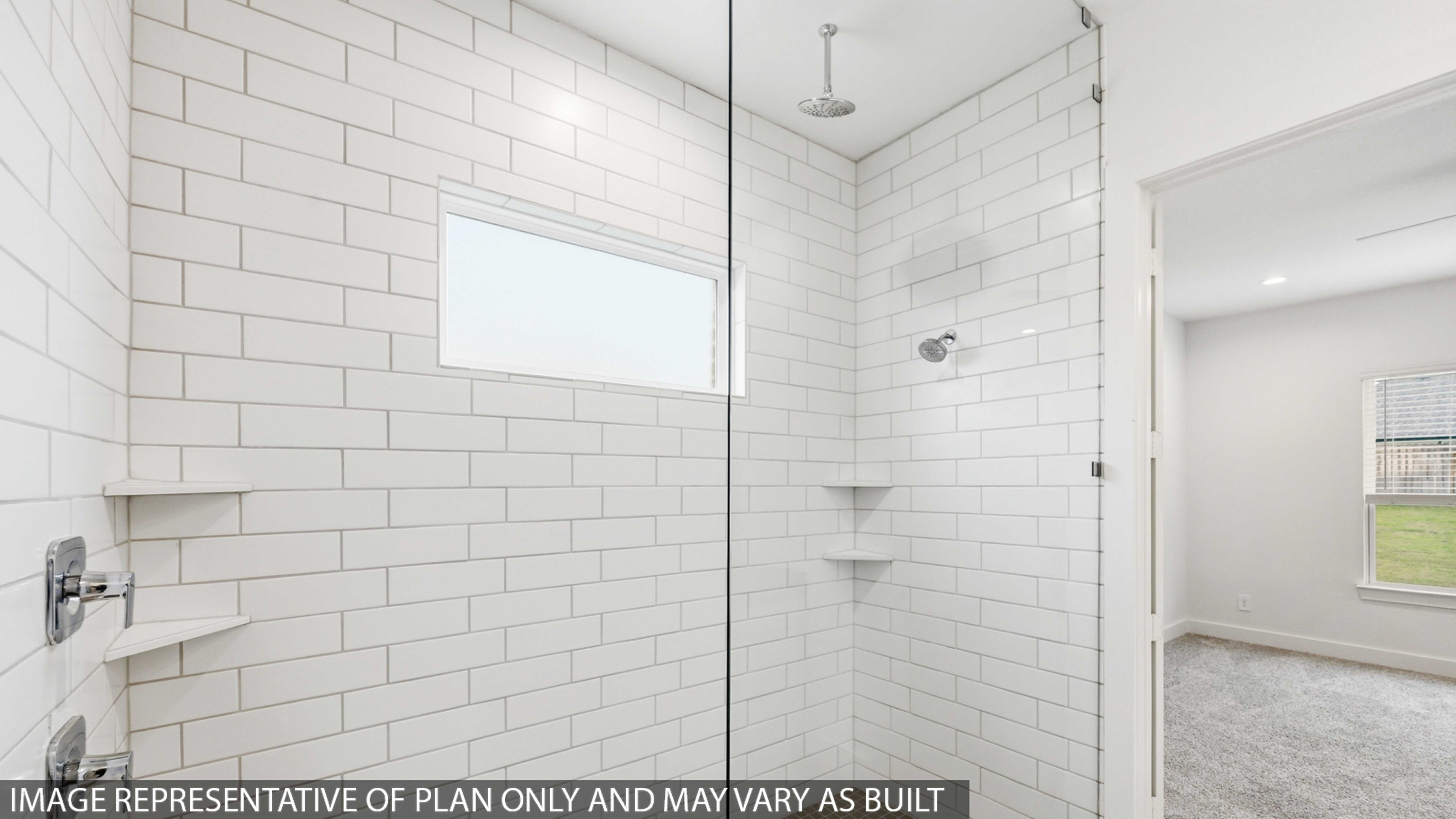 Primary bathroom with stand-alone shower with tiles and semi frameless glass in Montgomery TX