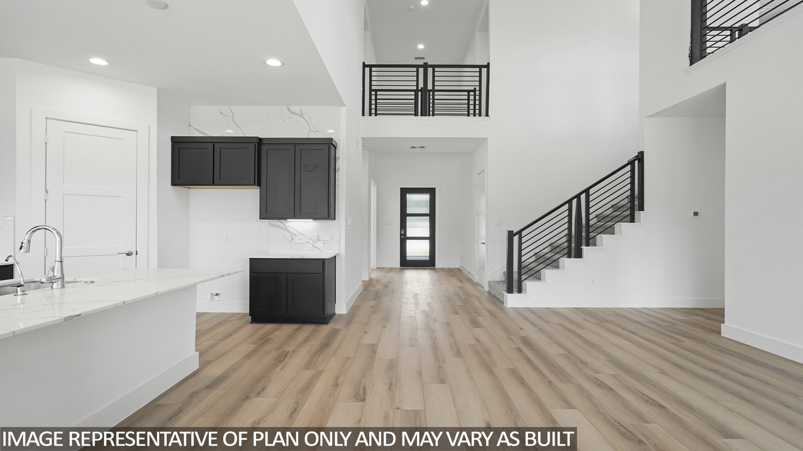 Open living room with windows, white walls, and vinyl wood flooring.