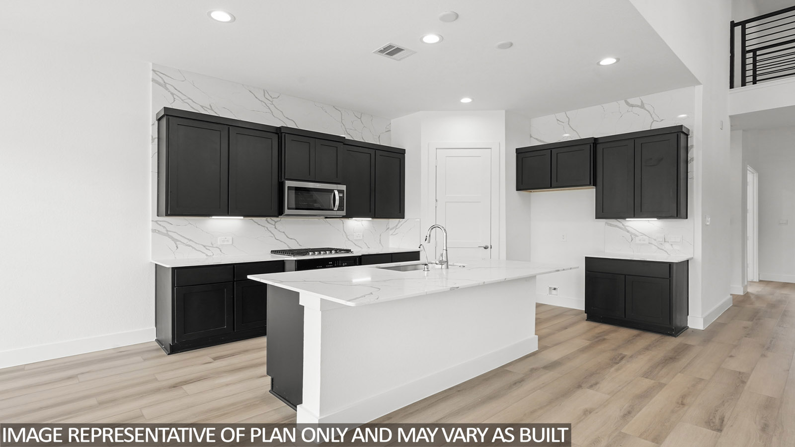 Open kitchen with an island, stainless steel appliances, dark cabinets, white walls, and vinyl wood flooring.
