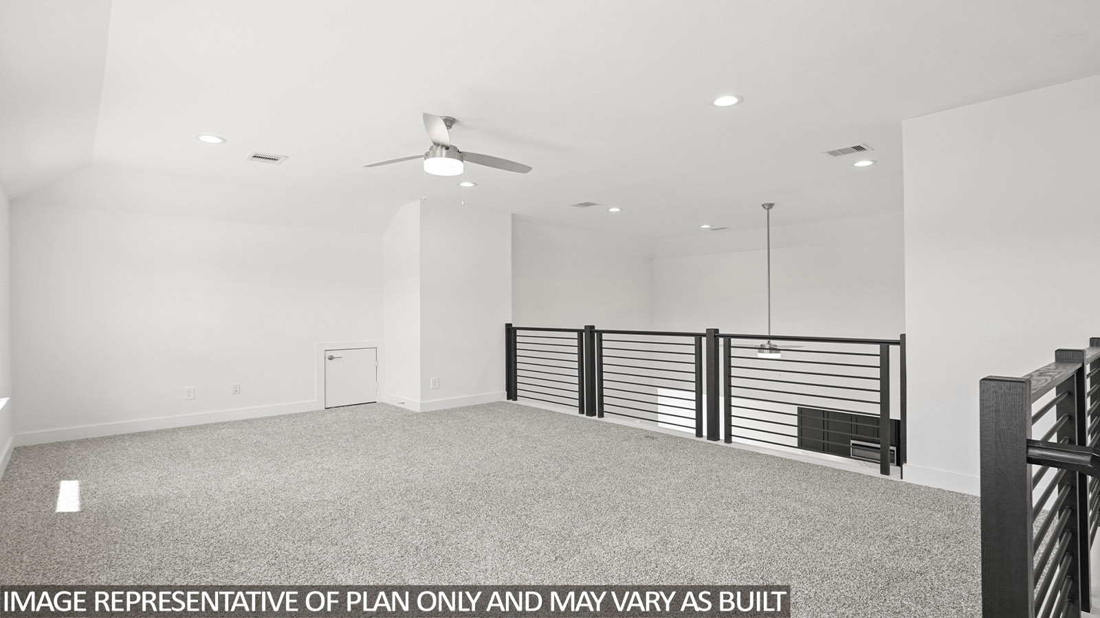 Large open game room with windows, white walls, and light carpet.