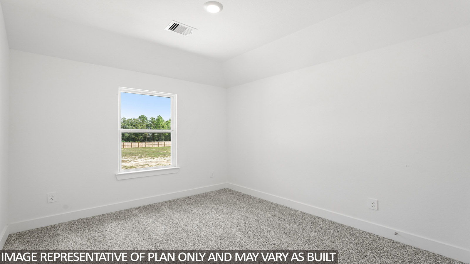 Secondary bedroom with windows, white walls, and light carpet.