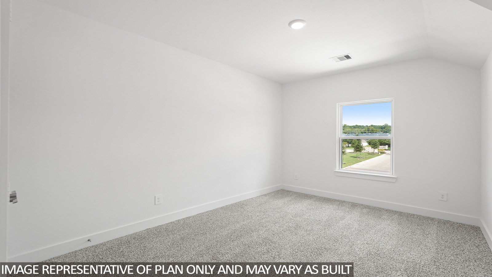 Secondary bedroom with windows, white walls, and light carpet.