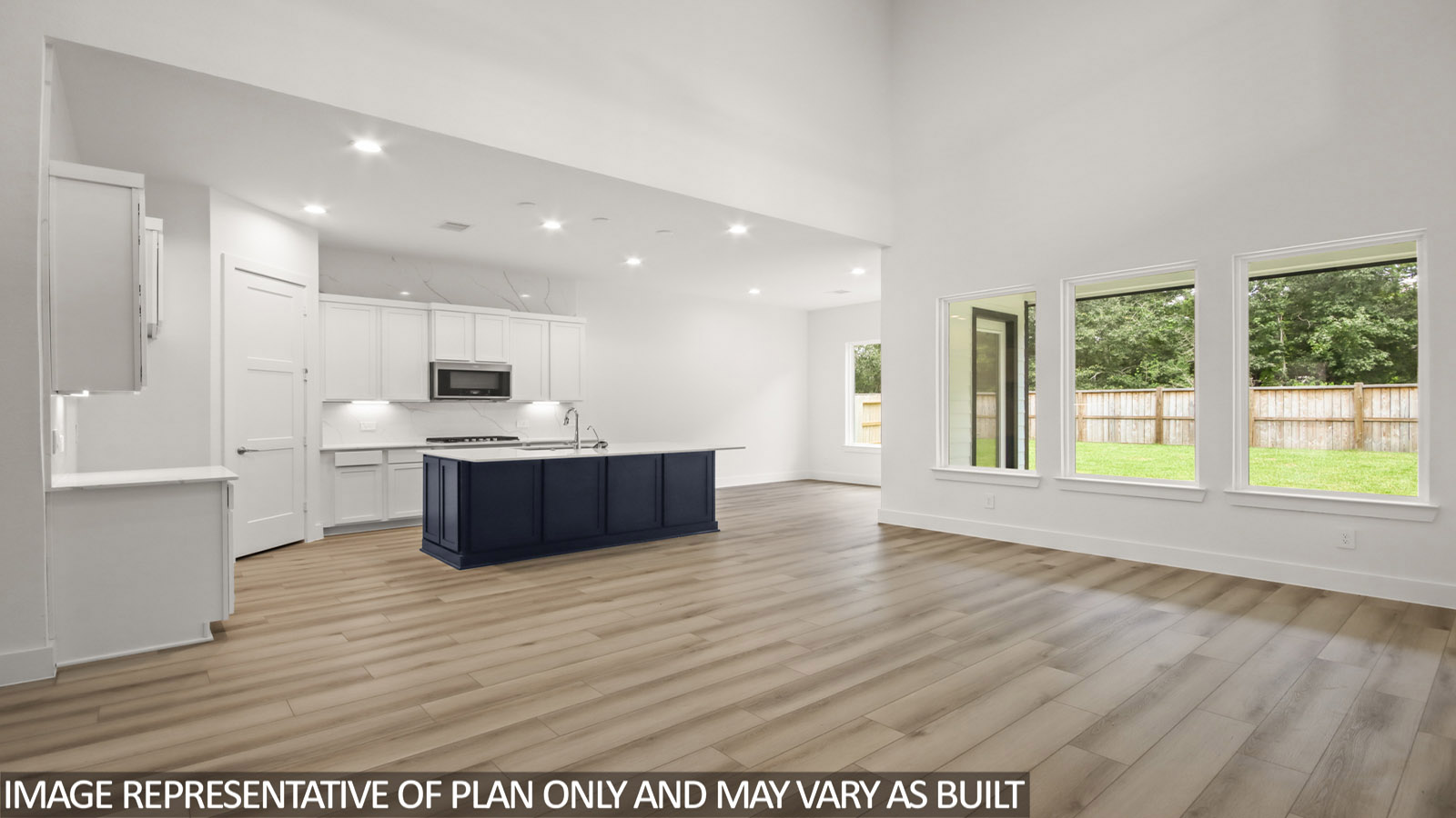 Kitchen with island and stainless-steel appliances.