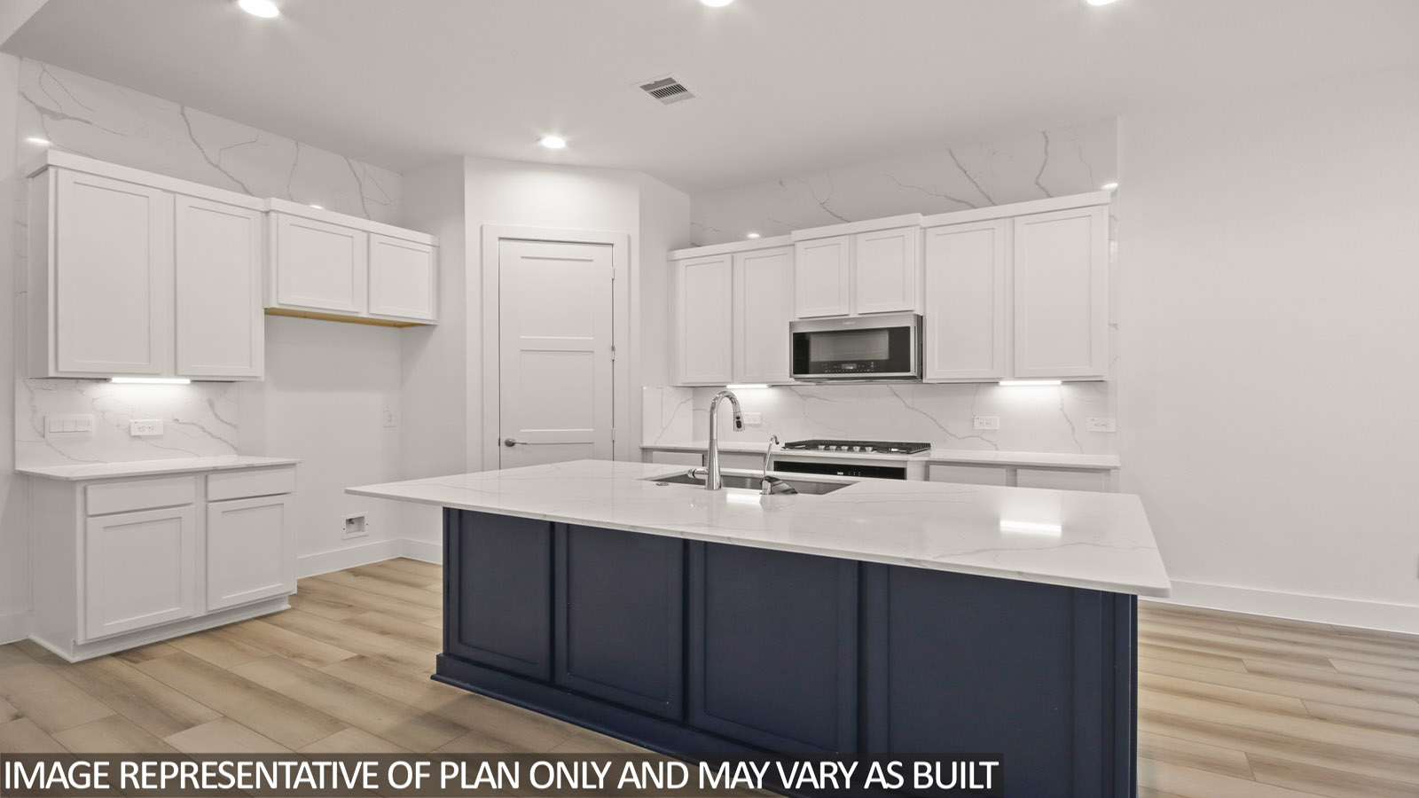 Kitchen with island and stainless-steel appliances.