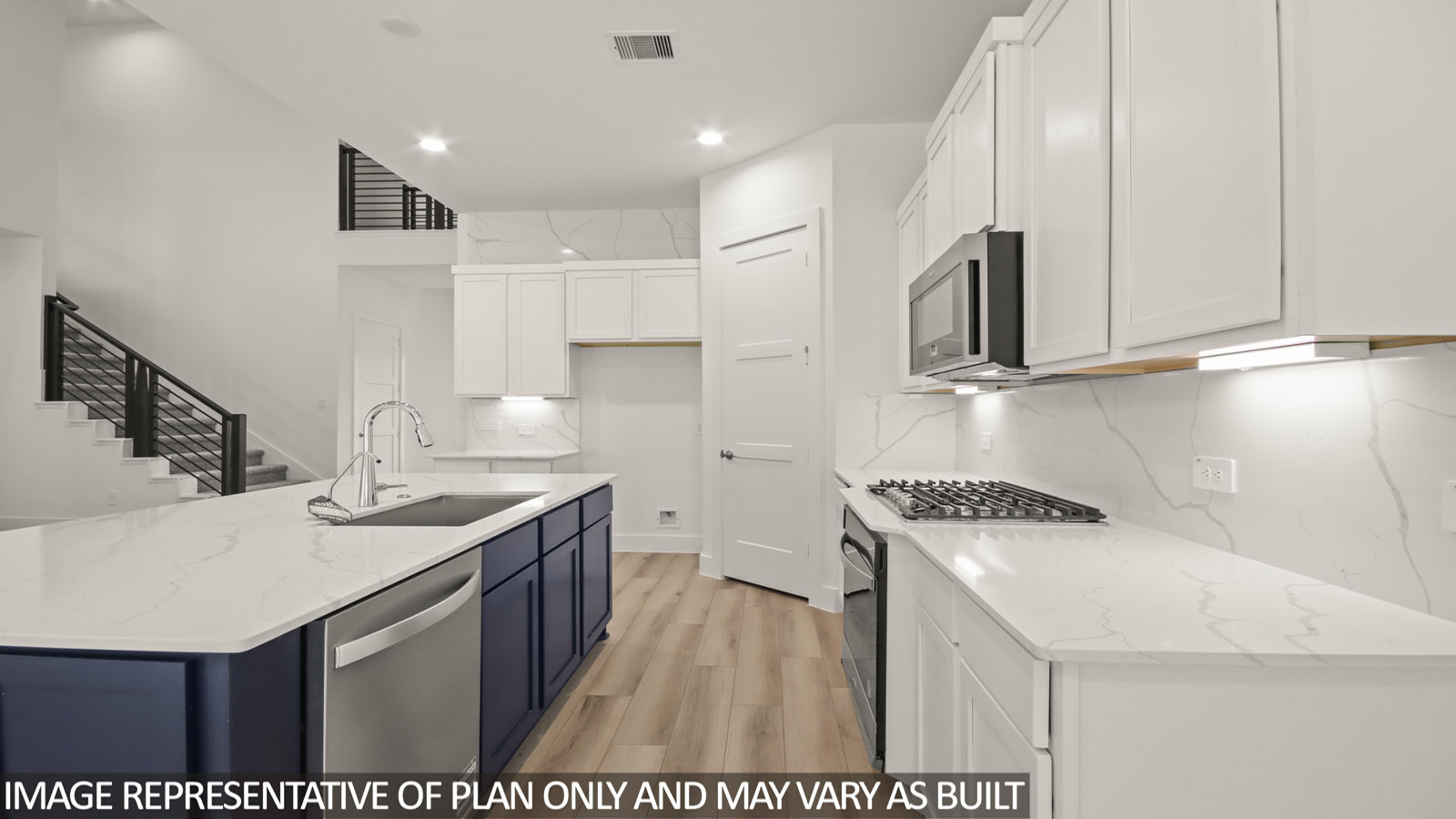 Kitchen with island and stainless-steel appliances.
