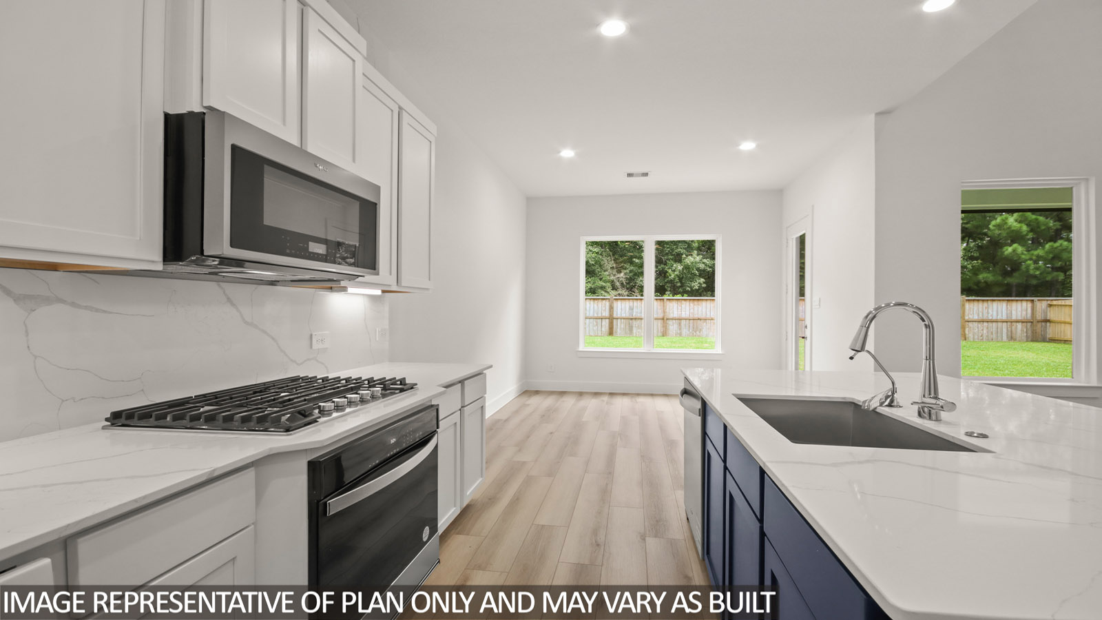 Kitchen with island and stainless-steel appliances.