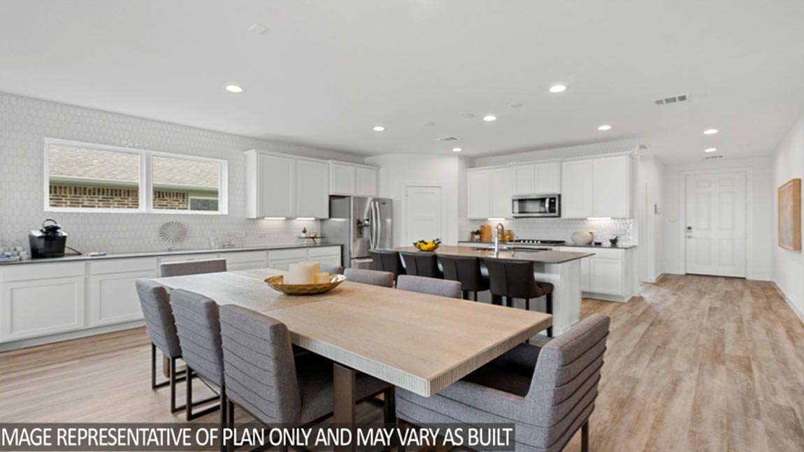 Open living room with windows, white walls, and vinyl wood flooring.
