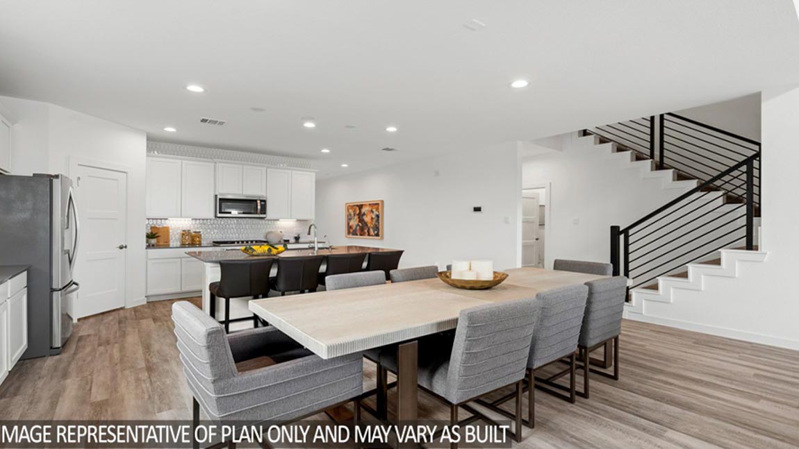 Open living room with windows, white walls, and vinyl wood flooring.