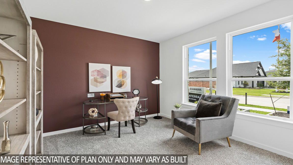 Secondary bedroom with windows, white walls, and light carpet.