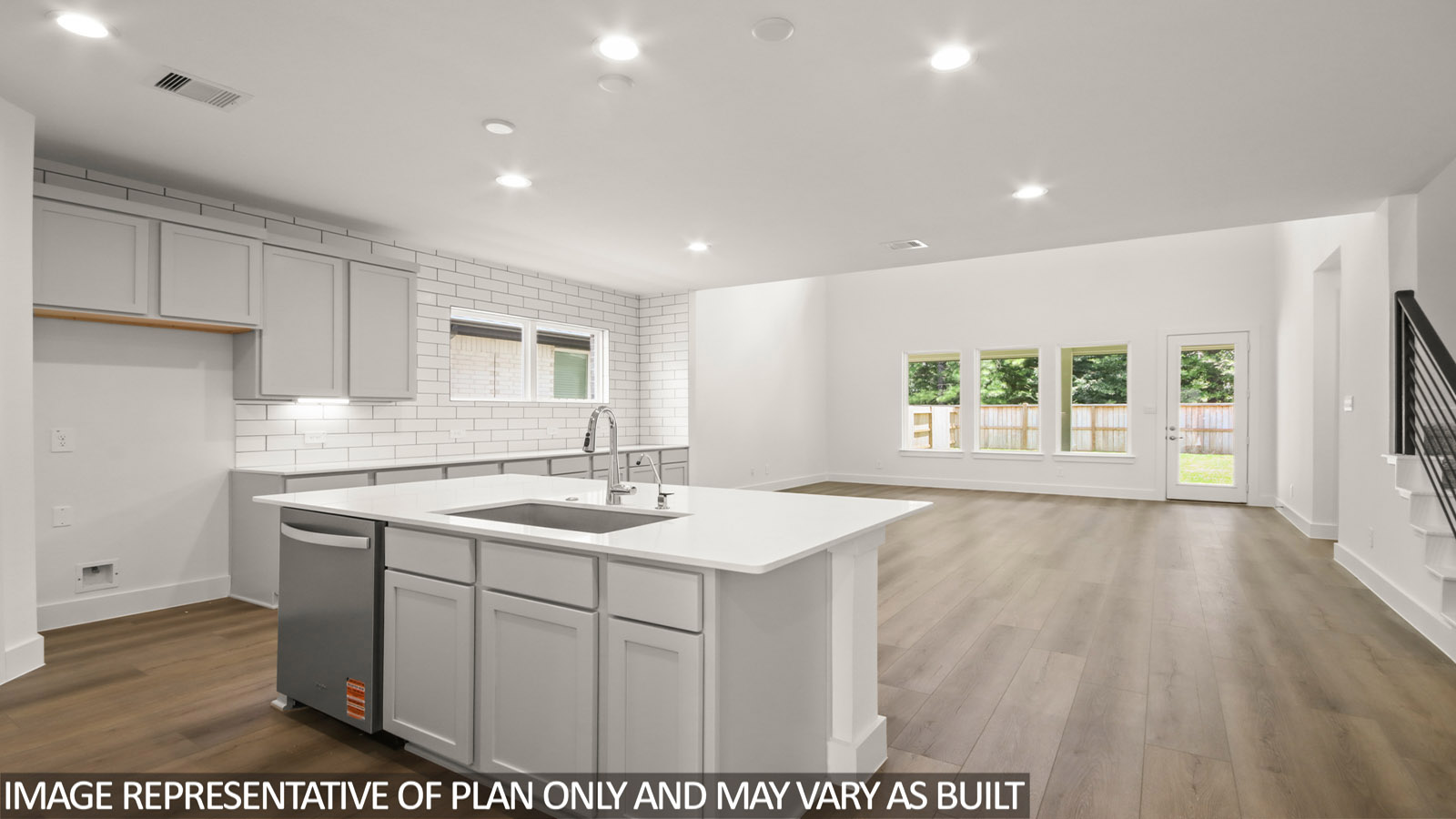 Kitchen with island and stainless-steel appliances.