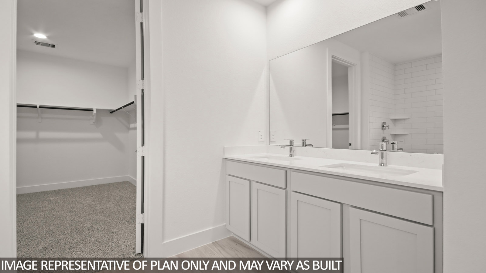Primary bathroom with dual sinks, super shower, white walls, and vinyl wood flooring.
