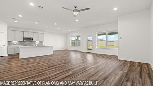 open concept living area with vinyl flooring