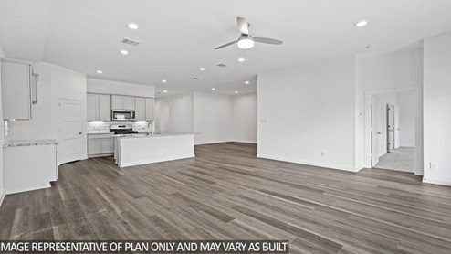 open concept living and dining are with vinyl flooring