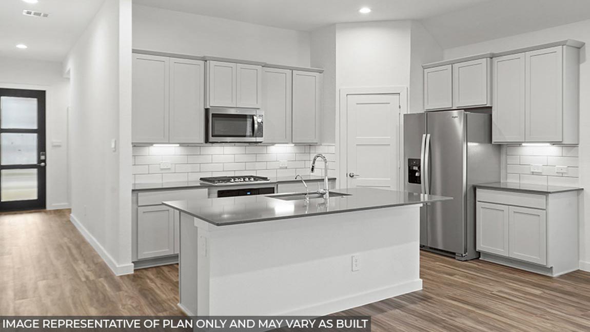 Kitchen with stainless-steel appliances and island.