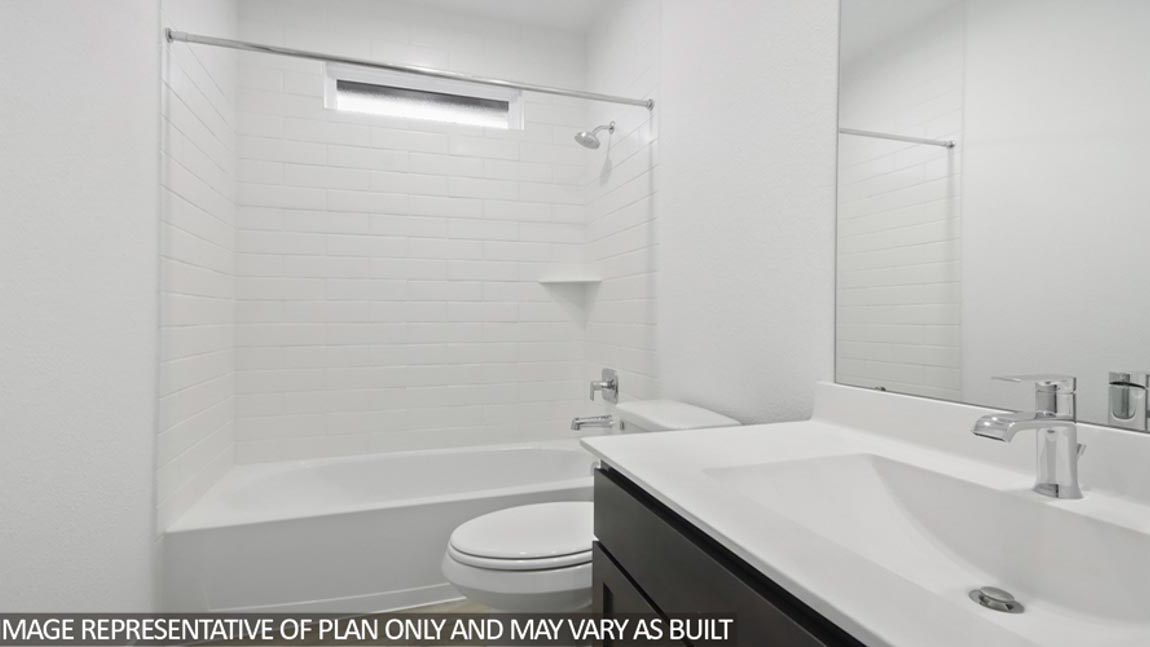 Secondary bathroom with tub/shower combo.