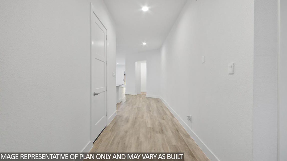 Kitchen with stainless-steel appliances and island.
