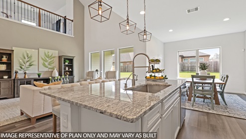 gourmet kitchen with stianless steel appliances and kitchen island with granite countertops