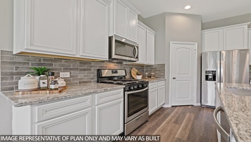 gourmet kitchen with stianless steel appliances and kitchen island with granite countertops