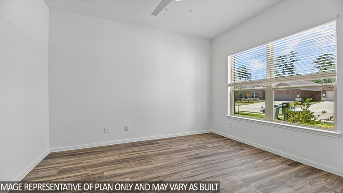 Private study with vinyl flooring and bright windows.