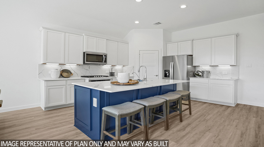Kitchen with stainless steel appliances and vinyl flooring.