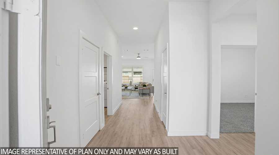 Entryway with vinyl flooring.