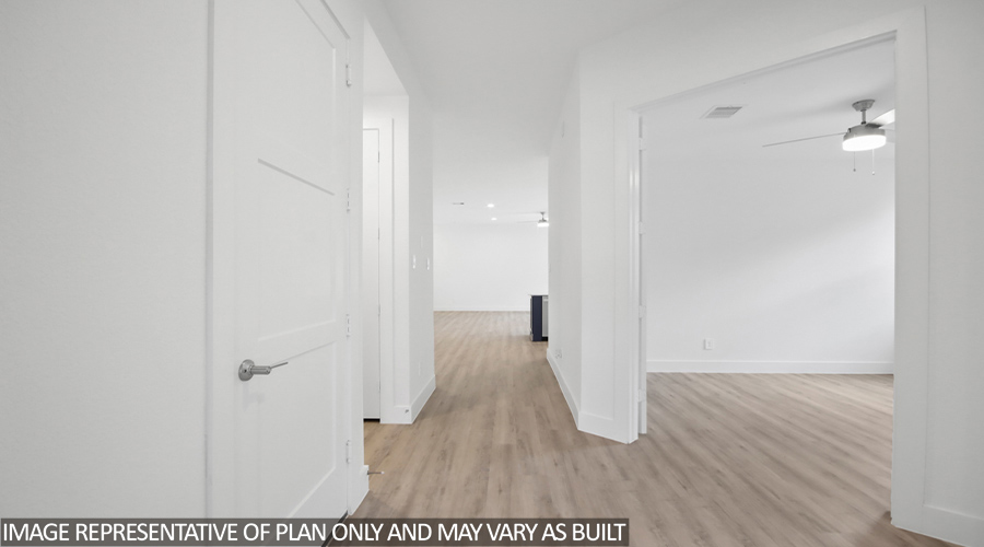 Entryway with vinyl flooring.