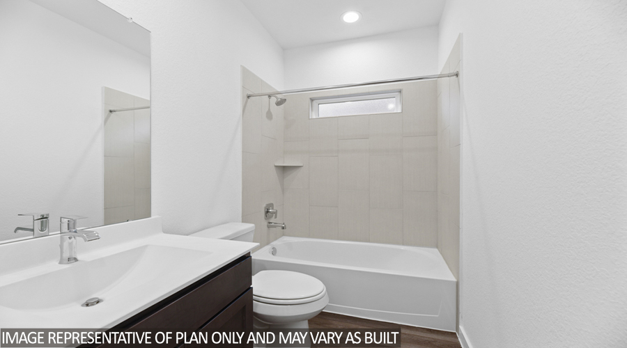 Secondary bathroom with tub/shower combo.