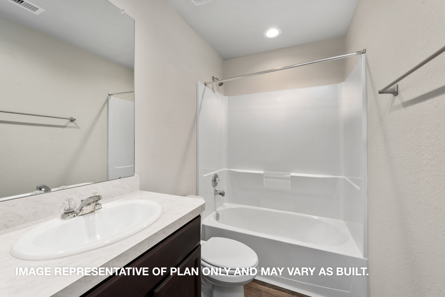 Secondary bathroom with tub/shower combo.