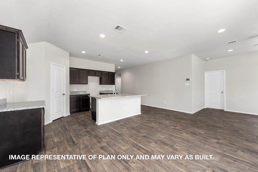 Kitchen with island and stainless-steel appliances.